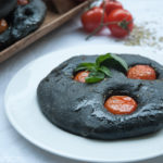 Focaccia multicereali al nero di seppia con ciliegini e origano per il contest “Blogger love Qb”